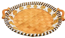 Load image into Gallery viewer, Round woven tray with striped rim and wooden handles on a white background
